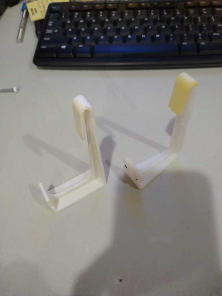 Image of RV curtain hook next to original for comparison.