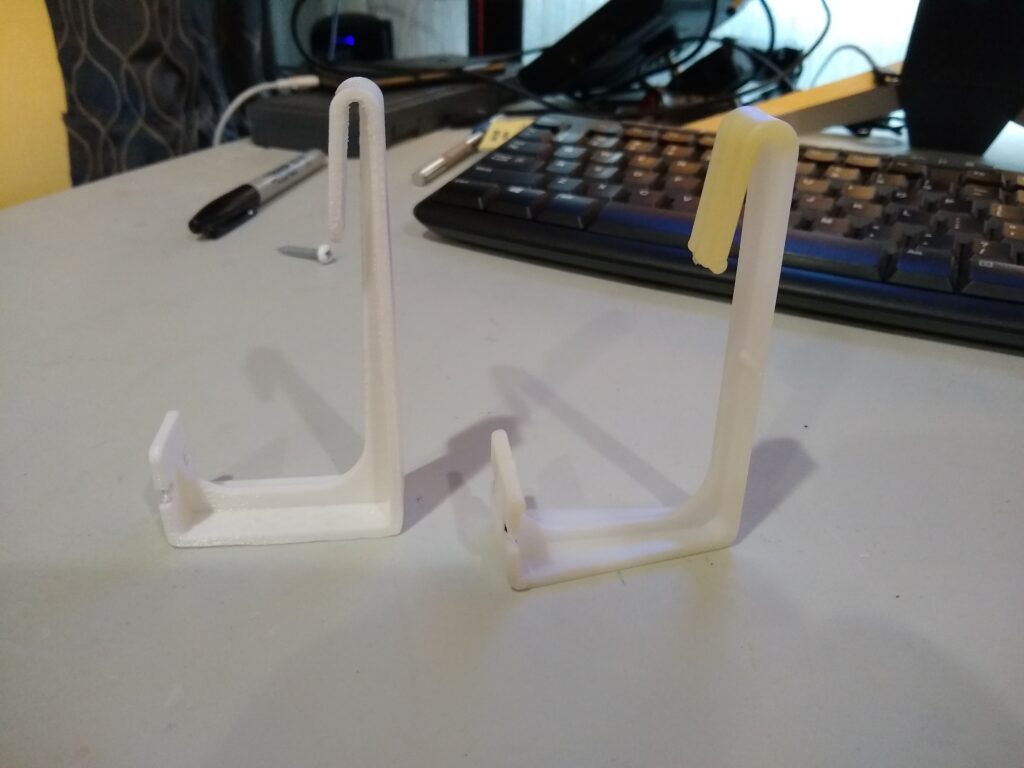 Image of RV curtain hook next to original for comparison.